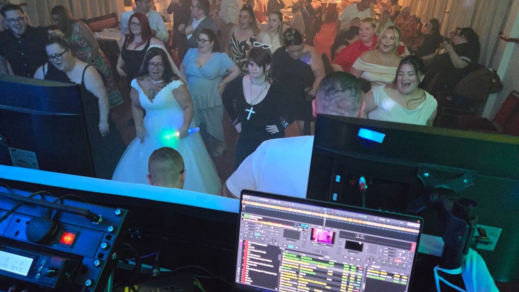View from the DJ booth showing the bride and guests dancing at a Portsmouth wedding party with Heard The Beat.