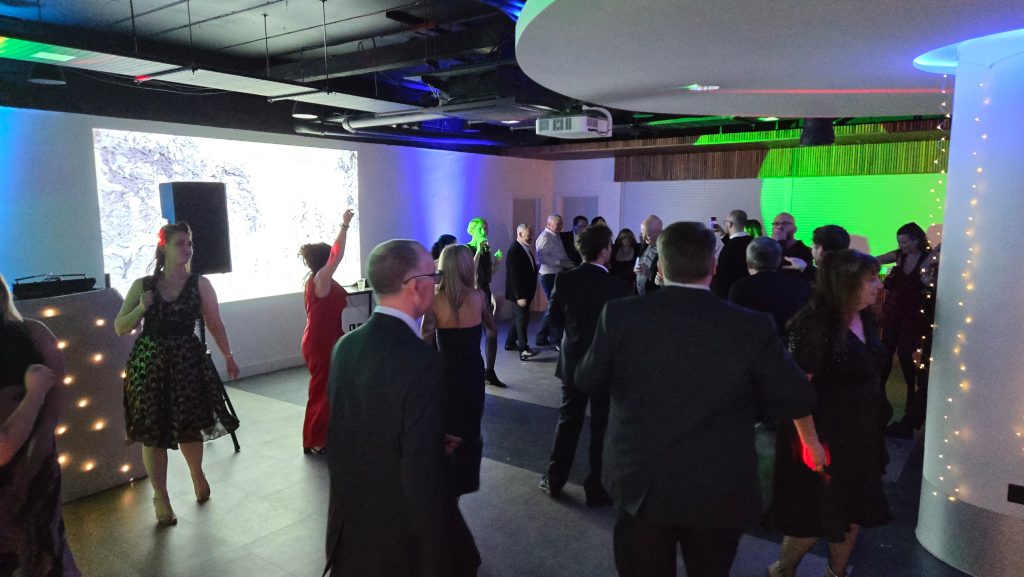 Corporate event dance floor at the Victory Suite Fratton Park with professional DJ lighting