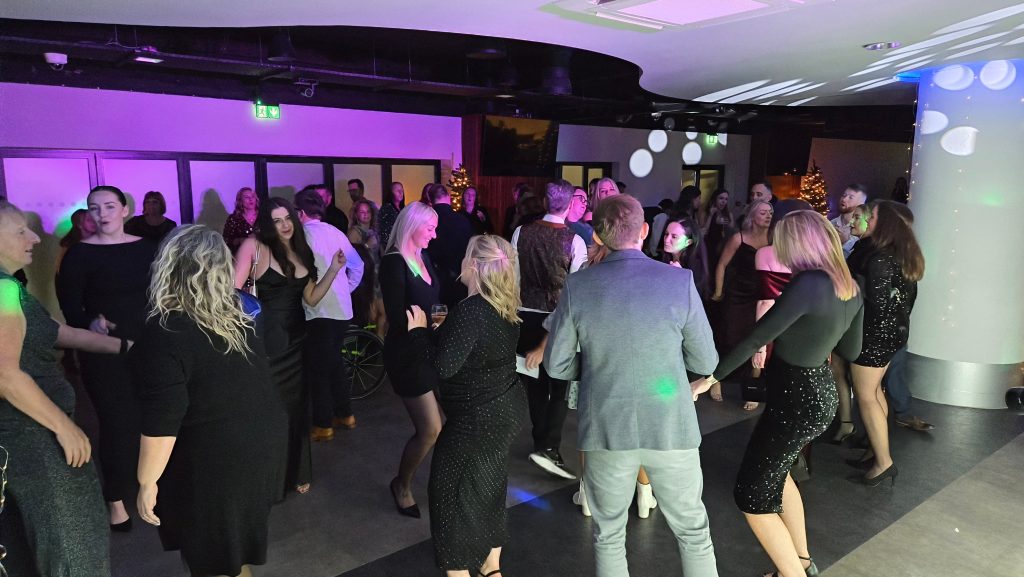 Corporate event dance floor at the Victory Suite Fratton Park with professional DJ lighting