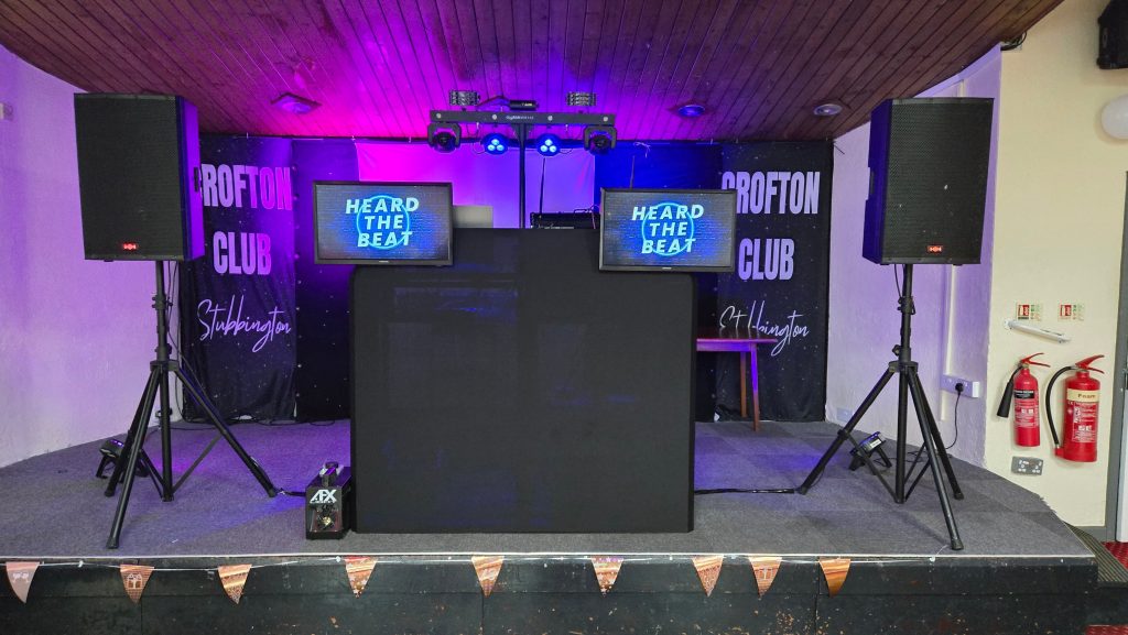 Professional DJ setup on stage at The Crofton Club in Stubbington with sound system, lighting and DJ booth by Heard The Beat