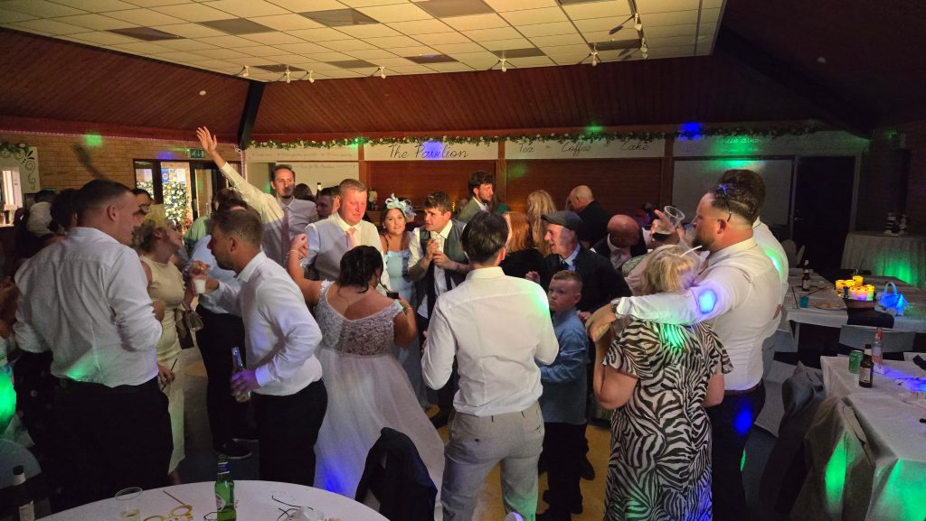 Evening wedding reception at The Pavilion Farlington with a full dancefloor and professional DJ setup by Heard The Beat