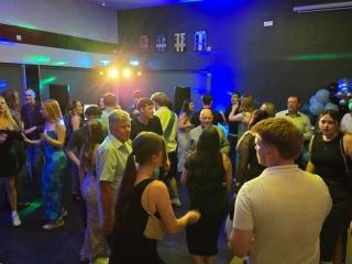 Birthday party guests dancing at Goals Portsmouth with professional DJ entertainment, colourful lighting and a high-energy atmosphere.