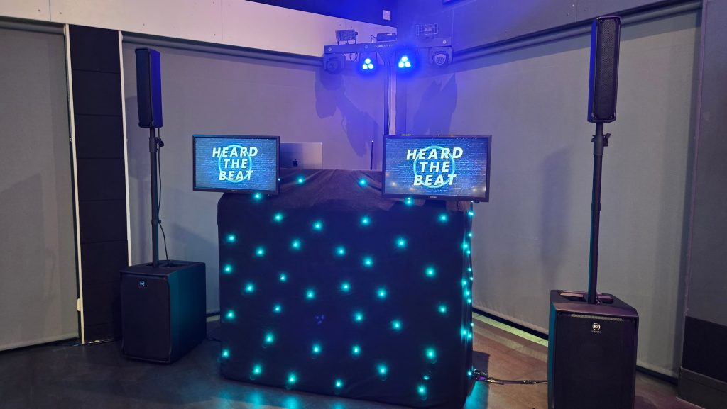 Professional DJ setup at Goals Portsmouth featuring speakers, lighting and branded DJ booth provided by Heard The Beat.