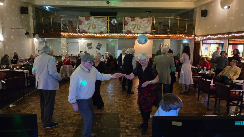 Guests dancing at a party at Fareham Social Club with DJ entertainment from Heard The Beat