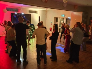 21st birthday party at Havant Rugby Club with DJ lighting and guests dancing on a busy dancefloor