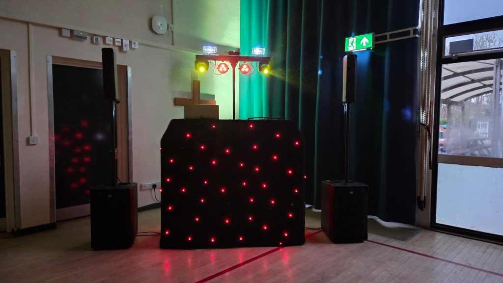 DJ setup at St Jude School Easter disco with lighting and sound system ready for a school disco event
