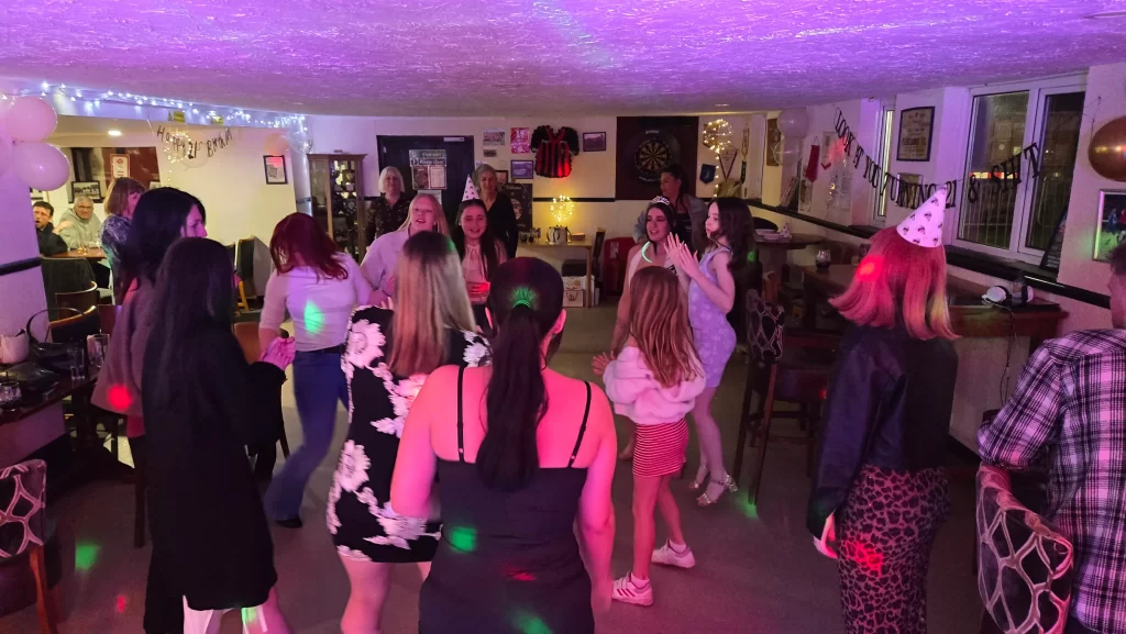 DJ at birthday party Fleetlands FC with guests dancing and party lighting in Gosport