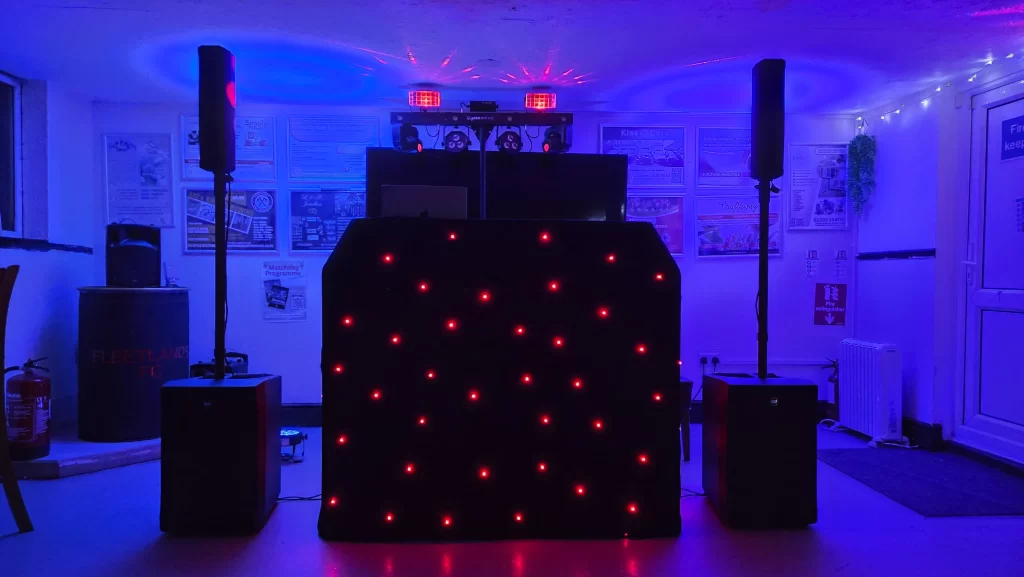 Professional DJ setup at Fleetlands FC with speakers, lighting and DJ booth ready for a party