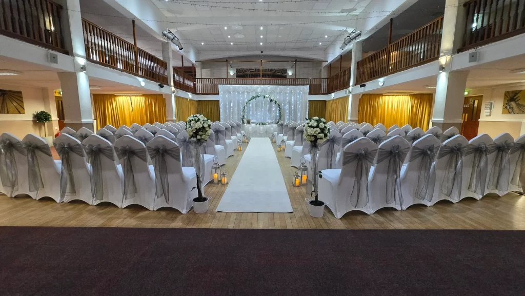 Wedding ceremony setup at Royal Maritime Hotel Portsmouth with aisle, chair decor and floral arrangements