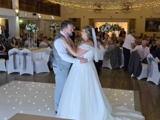 Bride and groom first dance at Royal Maritime Hotel Portsmouth with guests watching