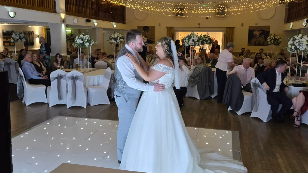 Bride and groom first dance at Royal Maritime Hotel Portsmouth with guests watching
