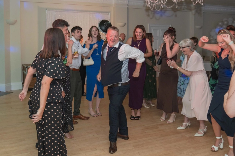 Guests dancing on a busy wedding dancefloor with professional wedding DJ entertainment by Heard The Beat in Portsmouth.