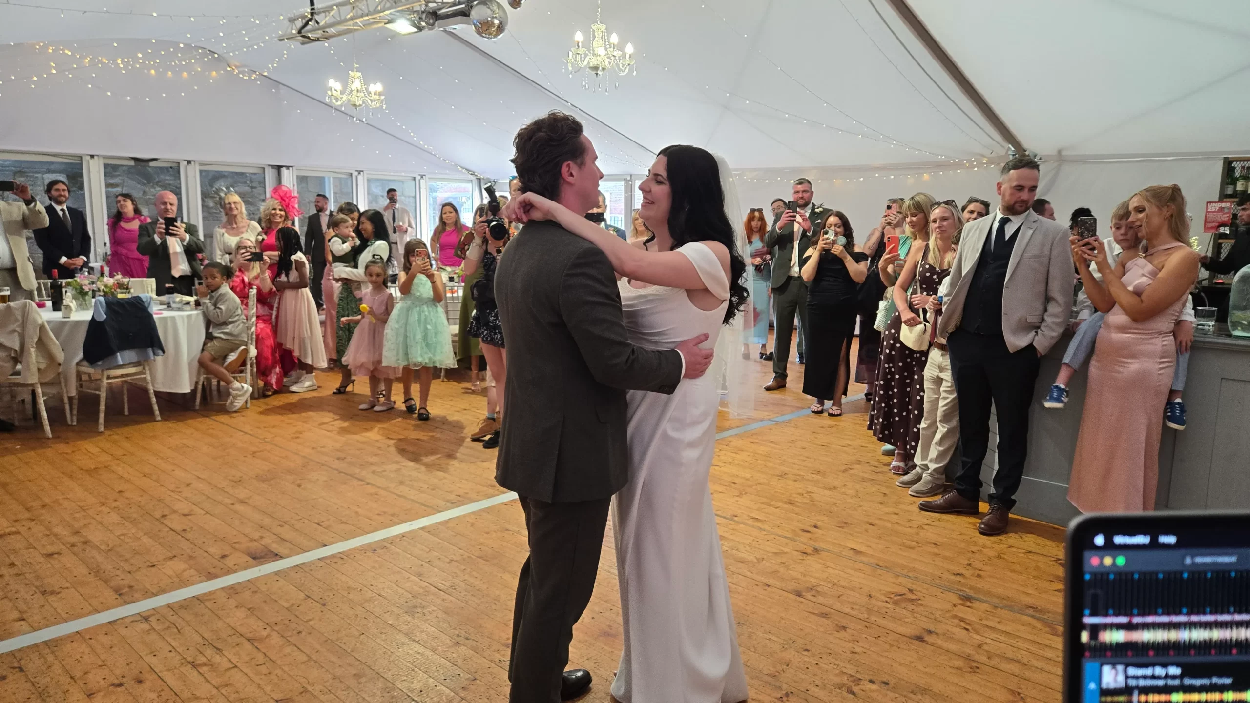 Bride and groom sharing their first dance surrounded by family and friends at their Hampshire wedding with Heard The Beat Wedding DJ.